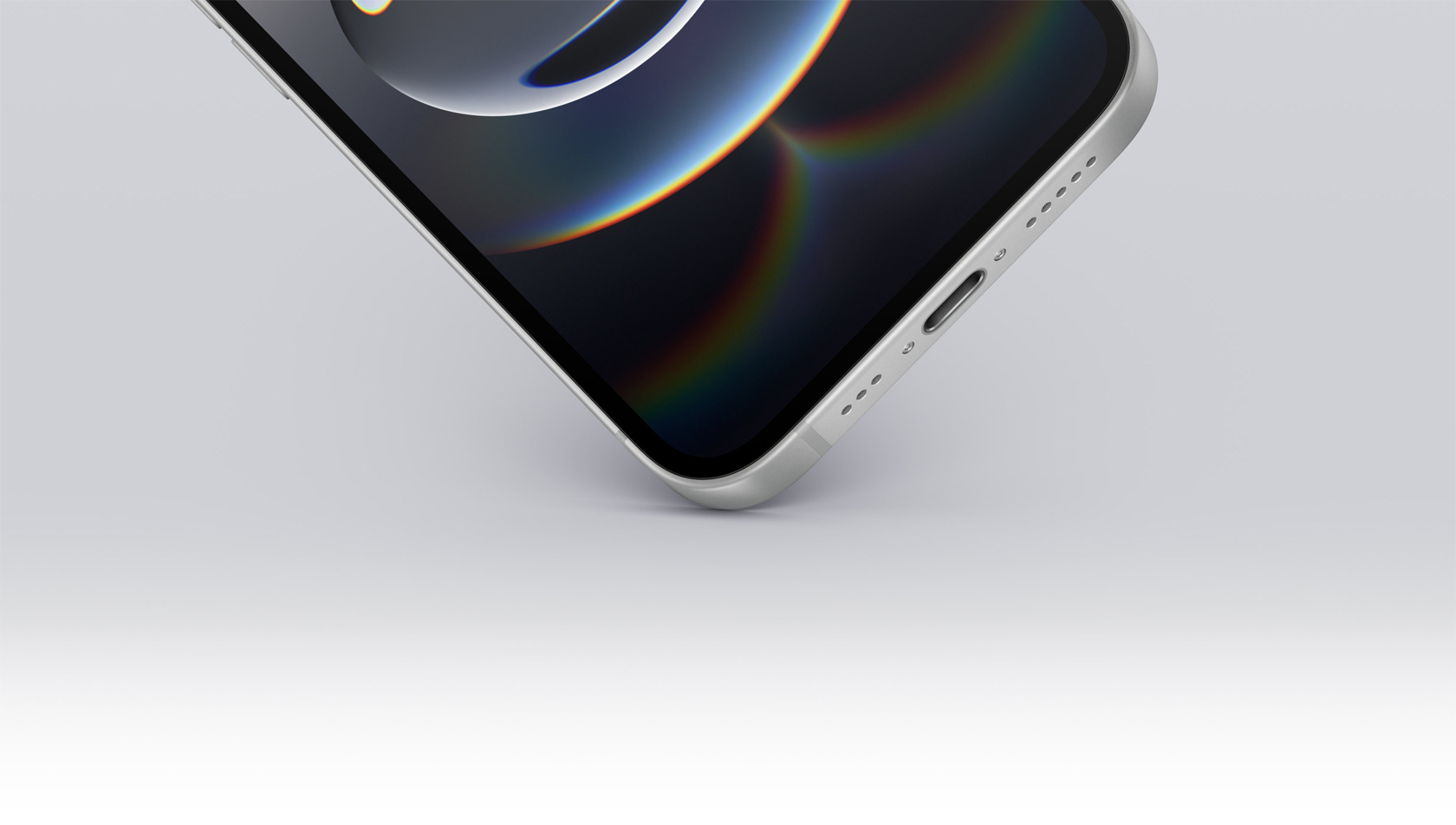 iPhone 16e bottom corner touching the ground showing USB-C port.