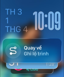 Three Apple Watch models, center in Natural color, face shows Smart Stack with Backtrack widget, right in Jet Black, face shows Workout screen, left in Rose Gold, face with Sleep score